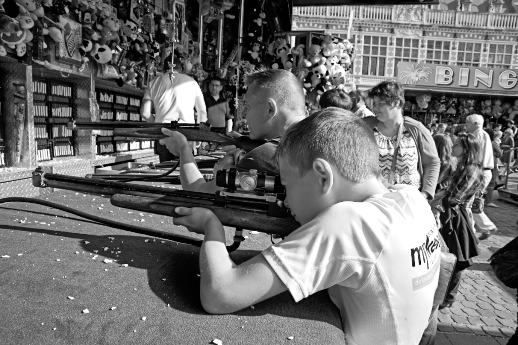 shooting gallery noun : a place where people shoot guns at objects for practice or to win prizes 