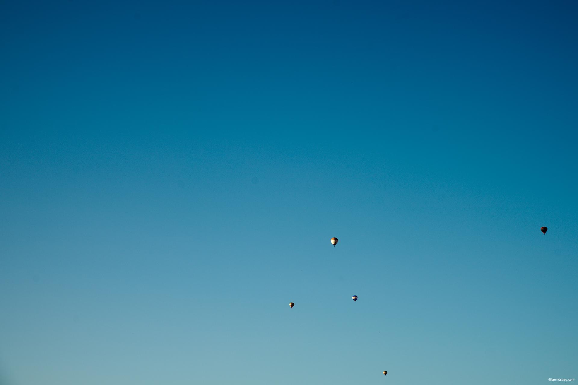 bal·loon (bə-lo͞on′) n. 1. a. A flexible bag designed to be inflated with hot air or with a gas, such as helium, that is lighter than the surrounding air, causing it to rise and float in the atmosphere. b. Such a bag with sufficient capacity to lift and transport a suspended gondola or other load. c. Such a bag shaped like a figure or object when inflated; an inflatable.